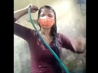 in a bathing suit takes a bath in the village