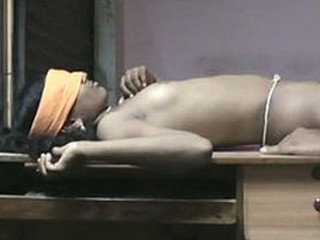 Andhra stunner gives a blowjob on a table