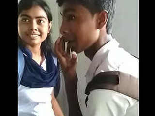 Desi couple shares spunky kisses in bedroom