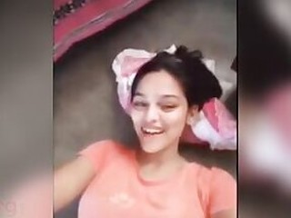 Pretty gal flaunts her milk cans and shaved pussy on the Hard-core camera