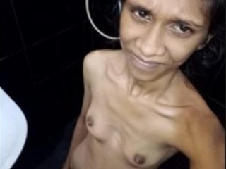 A slim nymph with puny  gets bare in the shower
