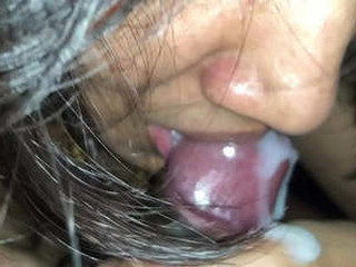A inviting Indian girl gives a close-up blowjob and drinks the cum