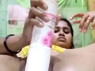 a stunning Indian chick use a bottle of air freshener for masturbation