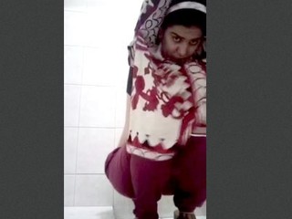See as a female takes a douche flash in front of the camera
