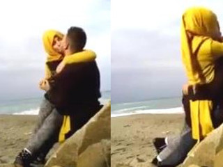 Hijab-clad duo shares a spunky kiss in the garden