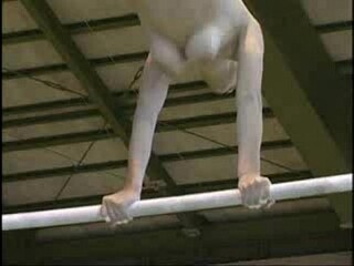 See as a gymnast performs her moves with relief and mercy